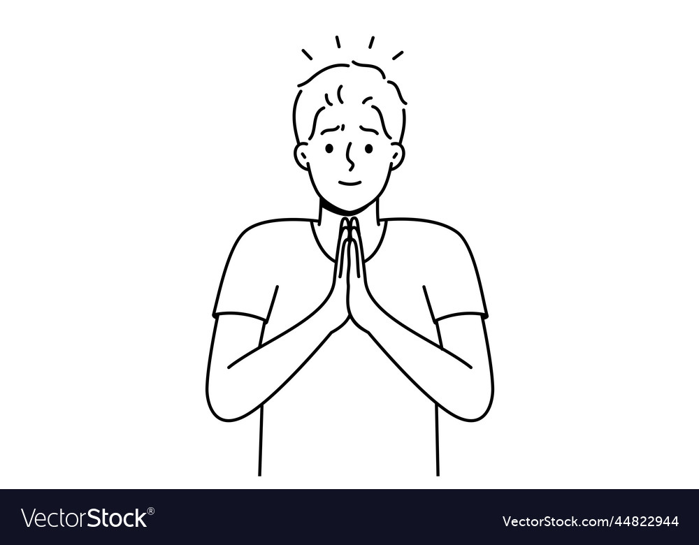 Young man with hands in prayer