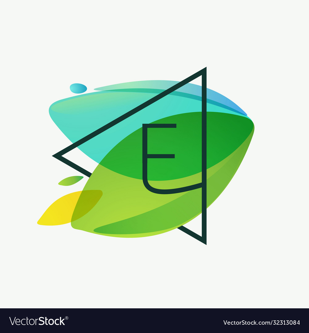 E letter logo in triangle frame at green leaves