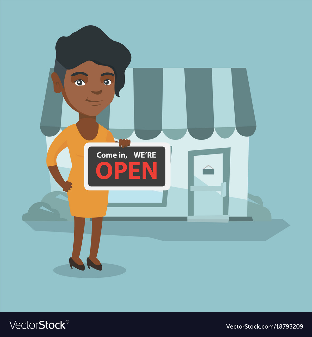 Young african shop owner holding open signboard