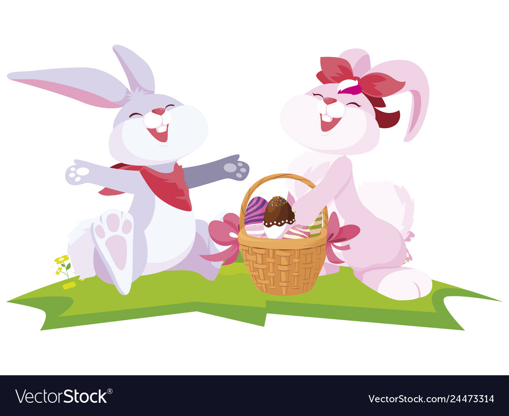 Cute rabbits couple with eggs painted in basket