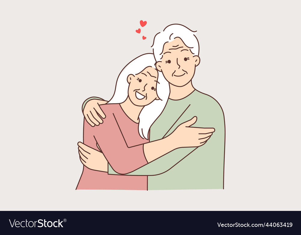 Happy elderly couple hugging