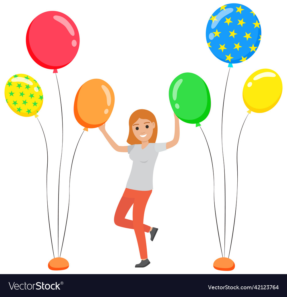 Young beautiful girl dancing between balloons