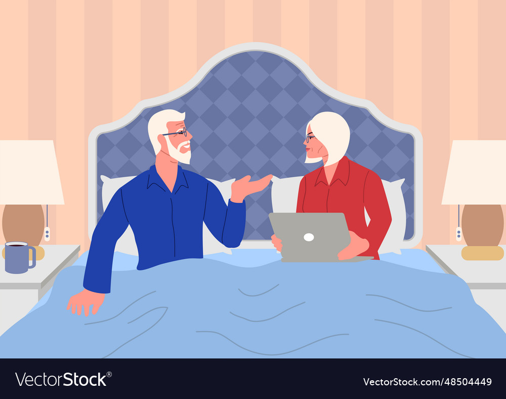 Elderly couple relaxing in bed having