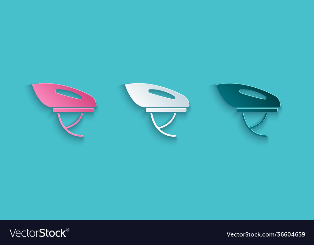 Paper cut bicycle helmet icon isolated on blue