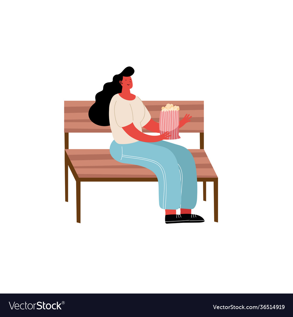 Young woman with bird food in park chair