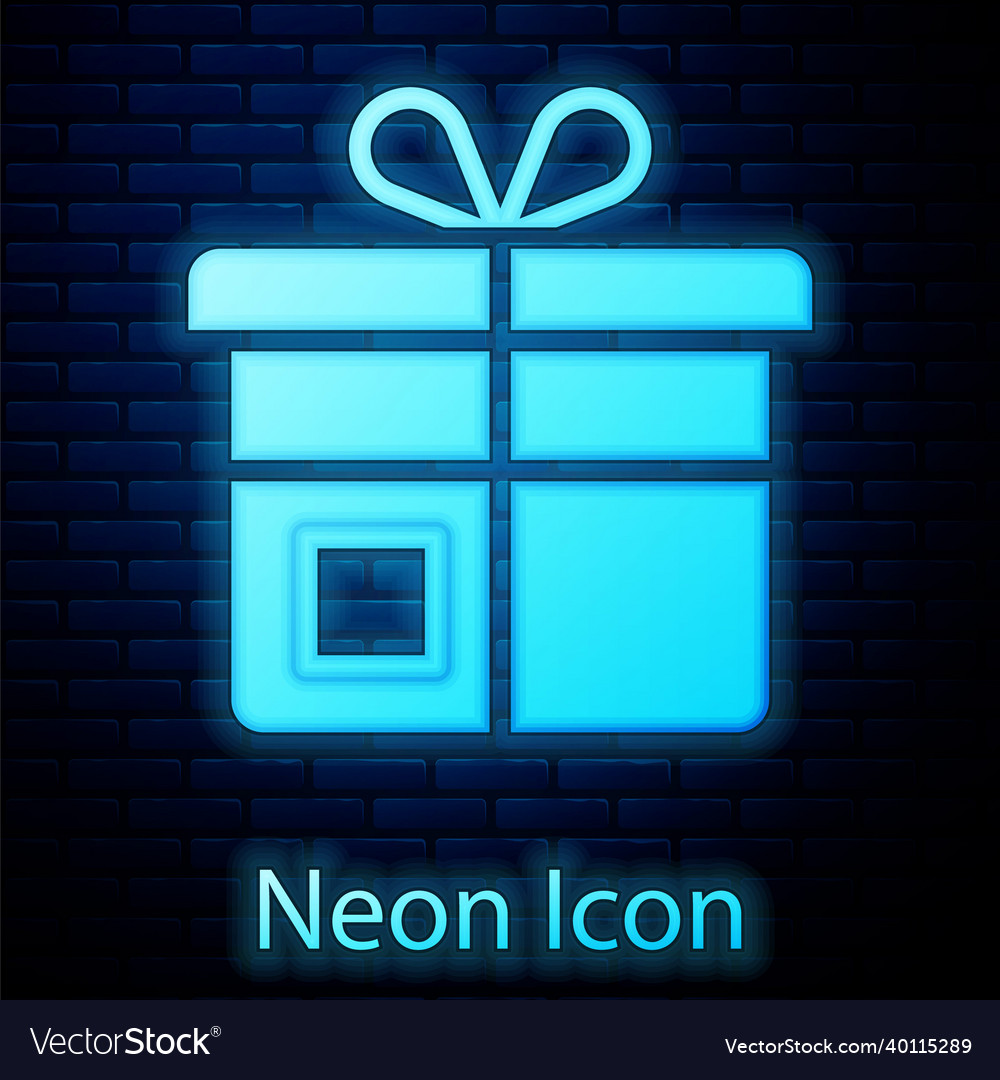 Glowing neon gift box icon isolated on brick wall