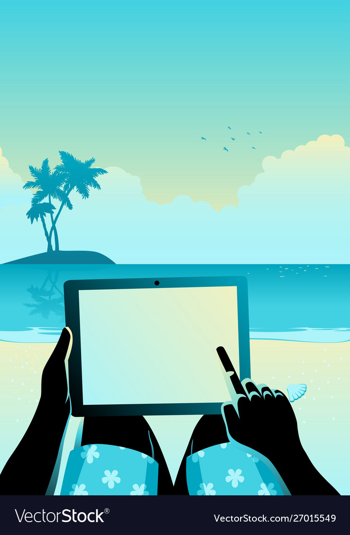 Man using tablet computer on tropical beach