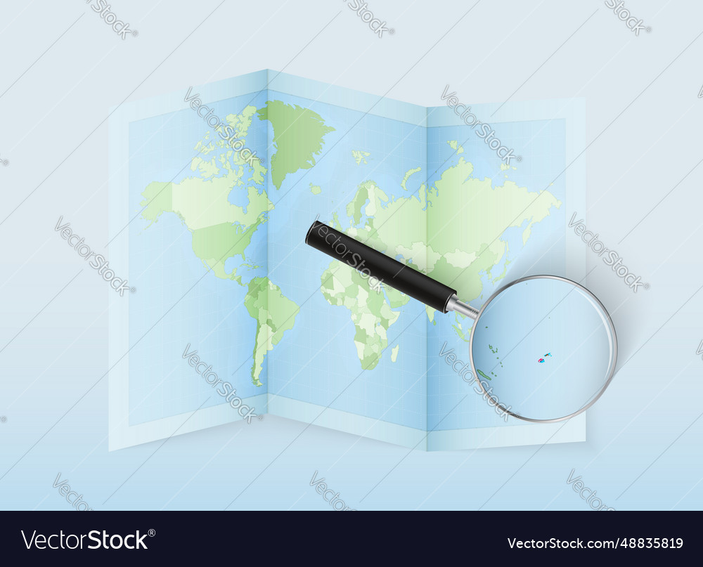 A folded world map with magnifying lens