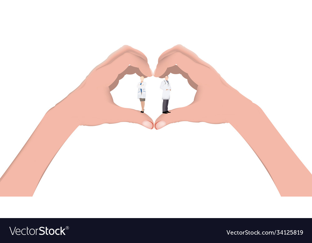 Hands joined in shape a heart with doctors