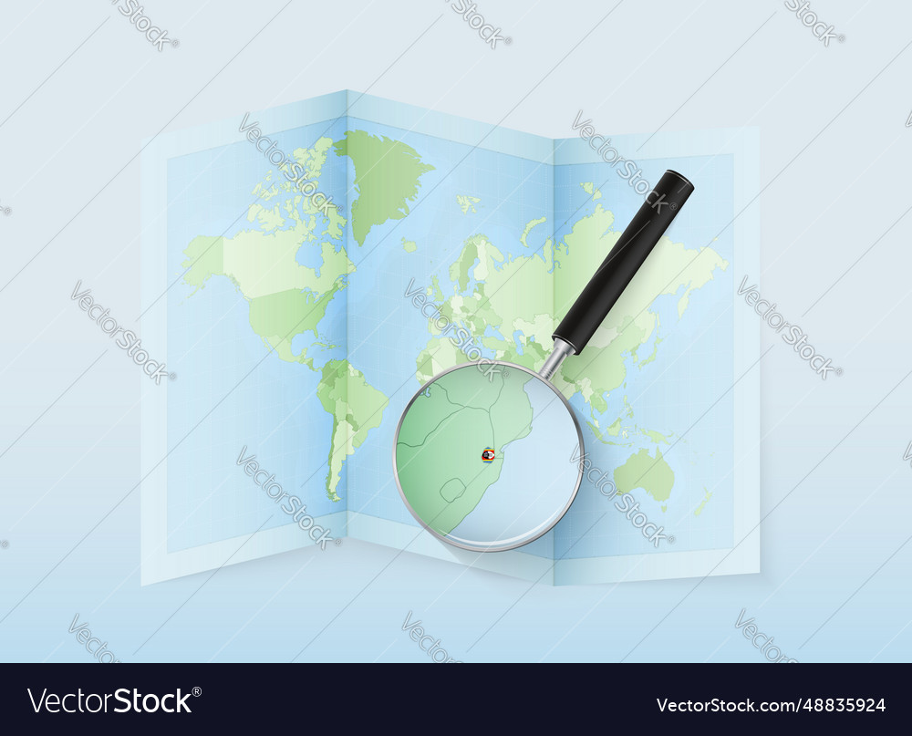 A folded world map with magnifying lens