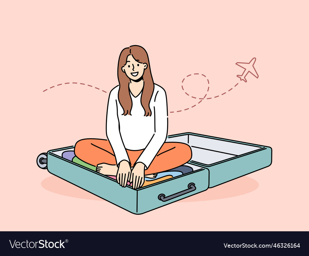 Smiling woman sit in suitcase excited about