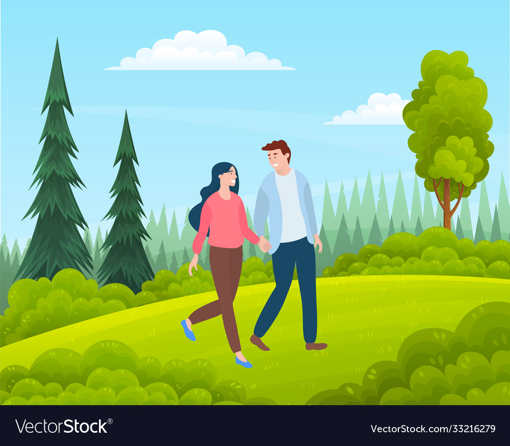 Couple walking in a forest young guy and girl