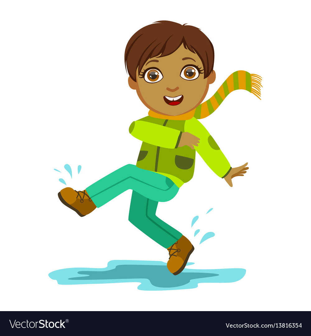 Boy kicking water with foot kid in autumn clothes