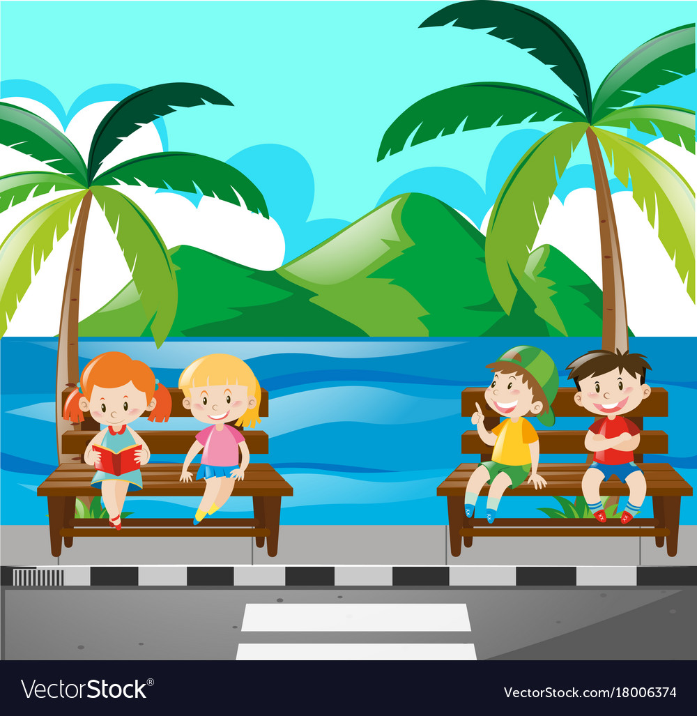 Children sitting on bench by the sea