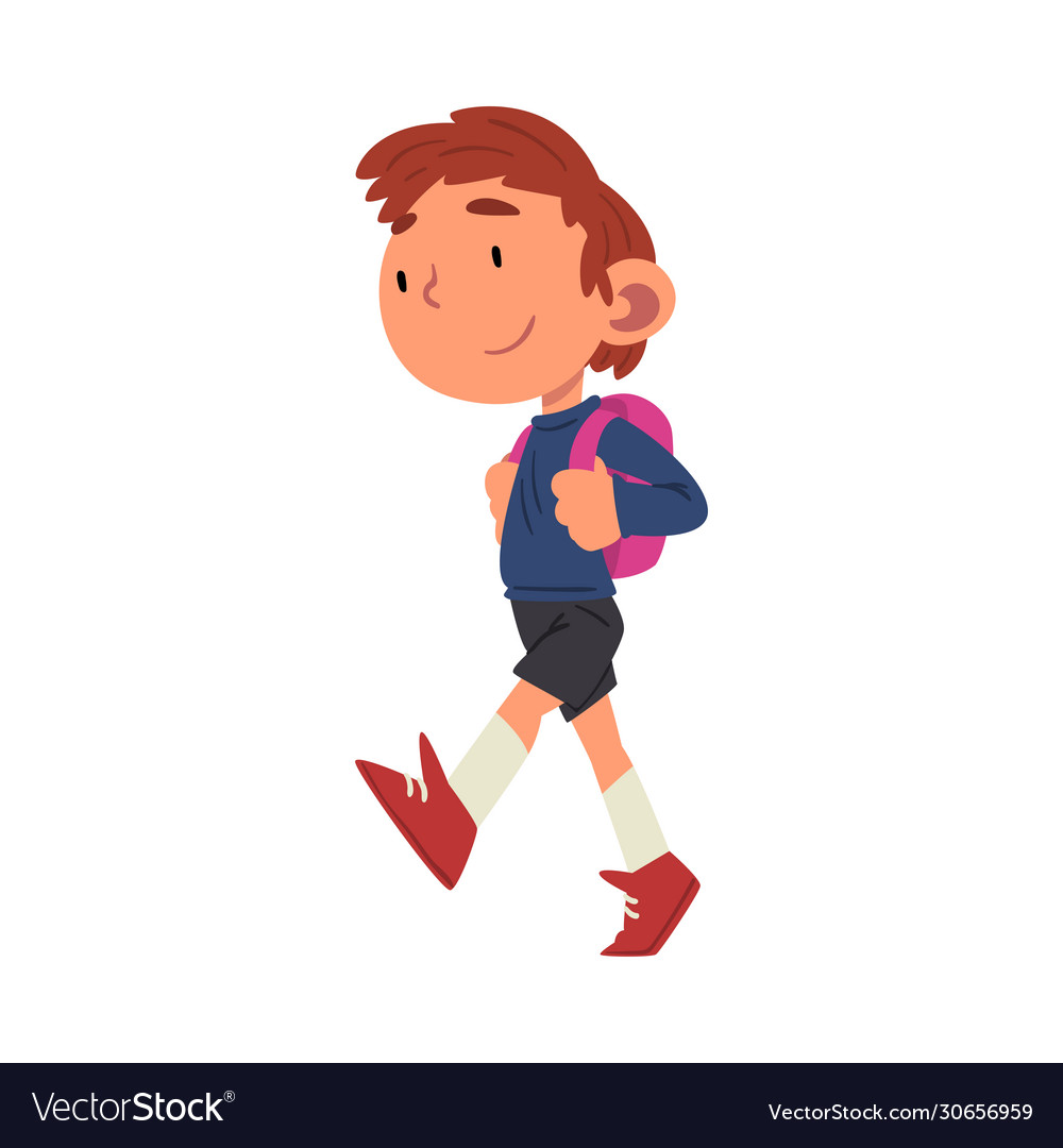 Cute boy walking at school with backpack