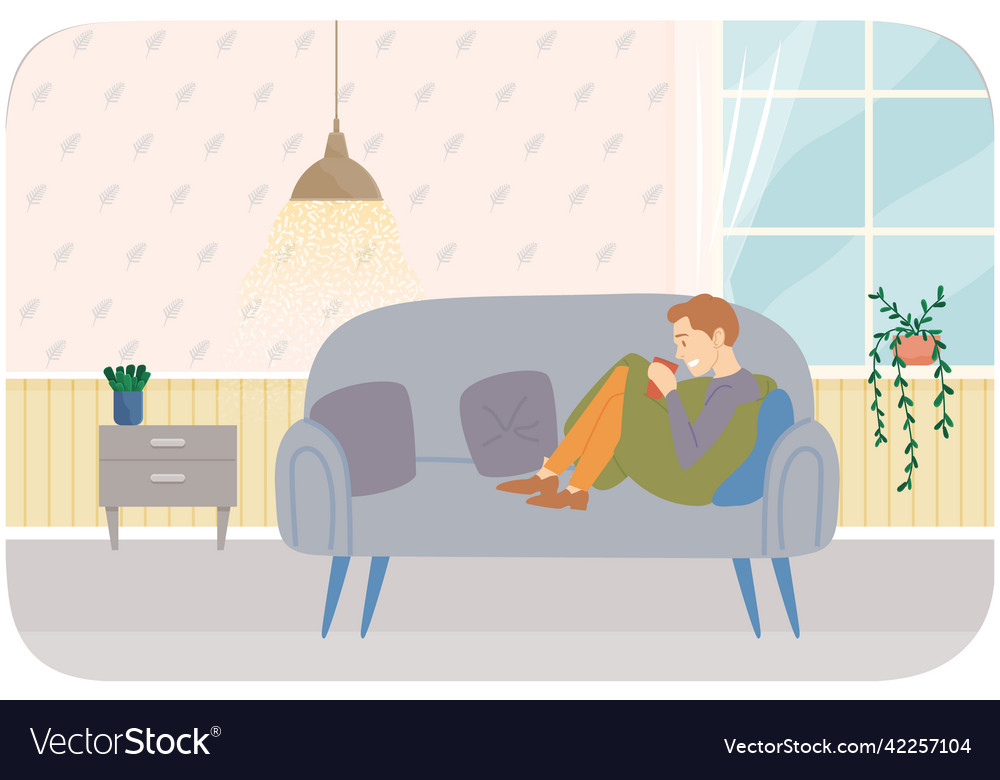 Guy resting with drink on comfortable sofa