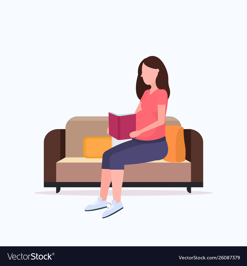 Happy pregnant woman sitting on couch and reading