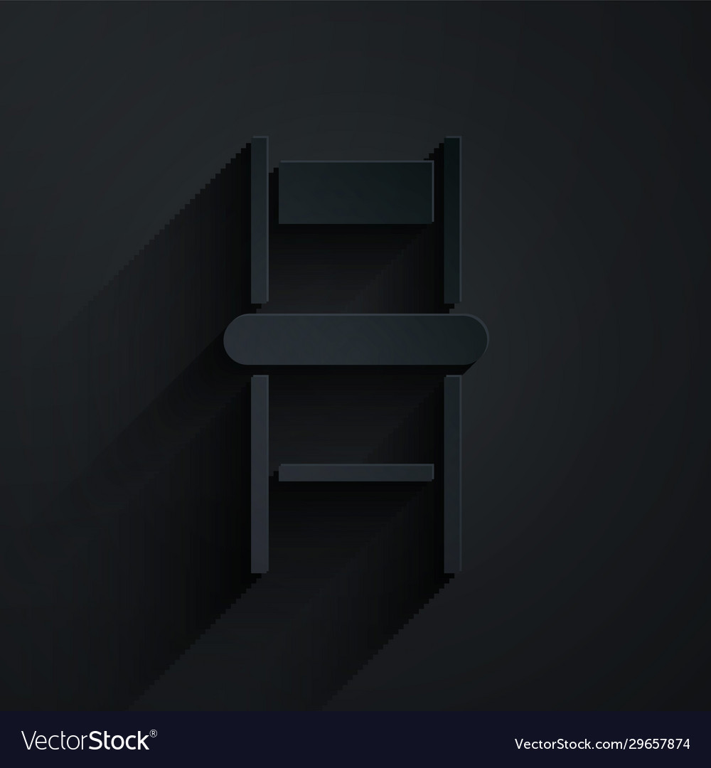 Paper cut chair icon isolated on black background