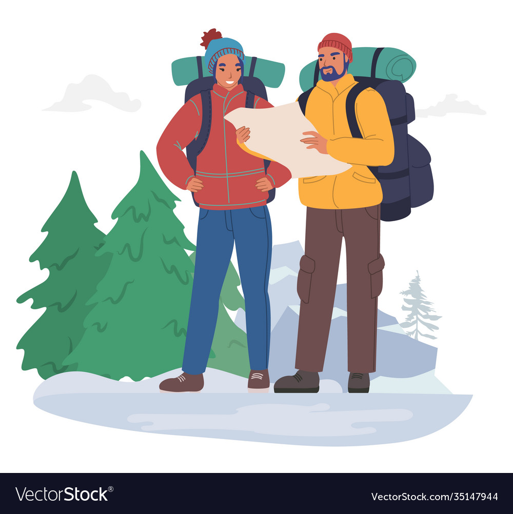 Happy tourist couple with backpacks wearing winter