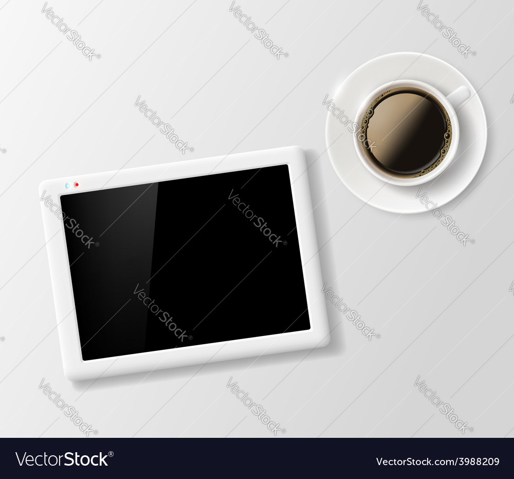 Cup of coffee and a digital tablet on the table