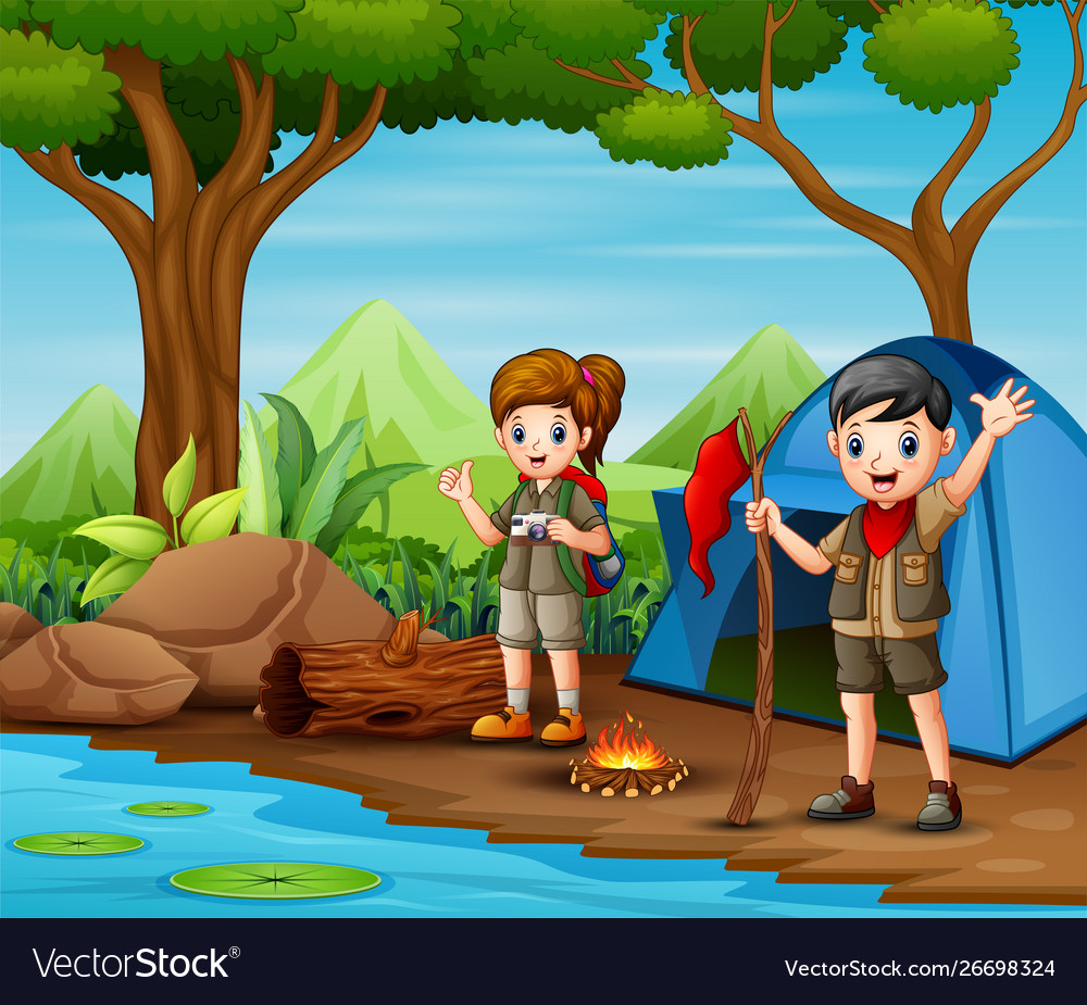 Scout boy and girl in uniform exploring forest