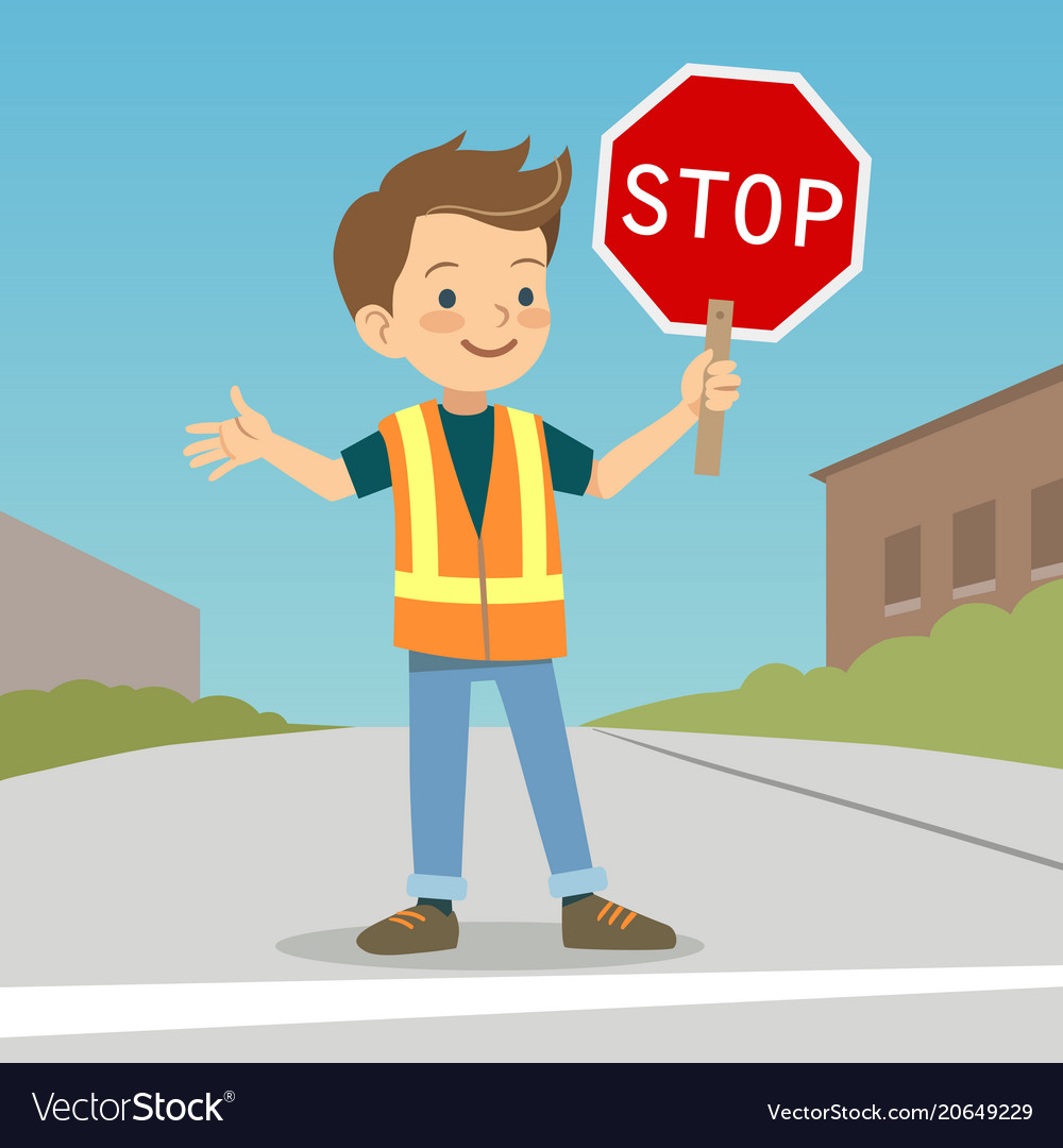 Little boy in crossing guard uniform the street