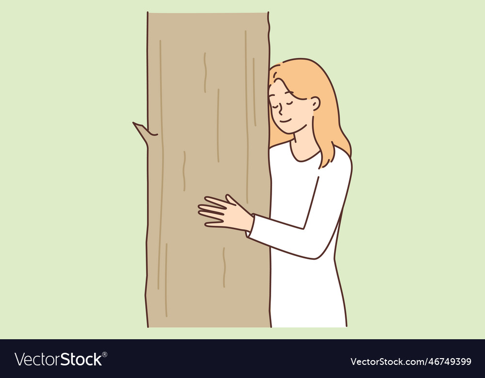 Teenage girl caringly hugging tree cuddling up