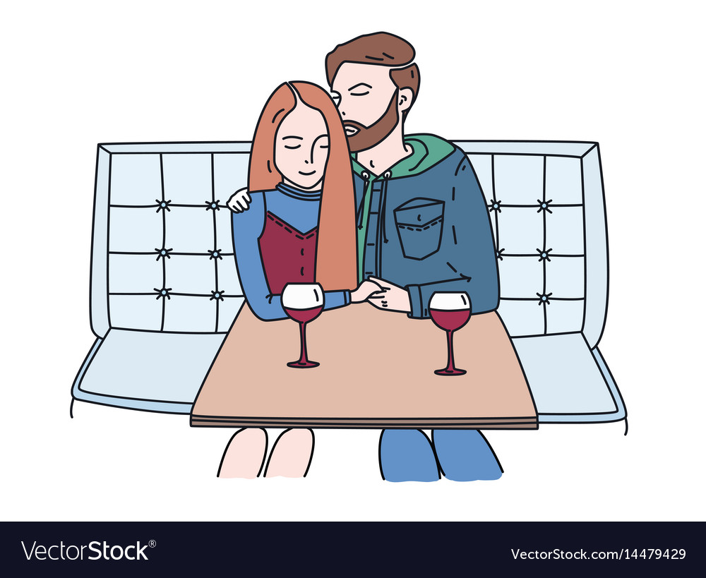 Young couple sits in a cafe and drinks wine