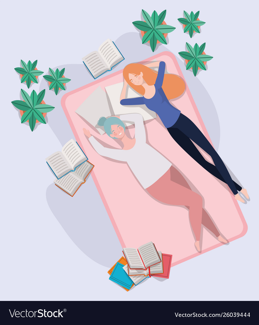 Young women relaxing in mattress bedroom