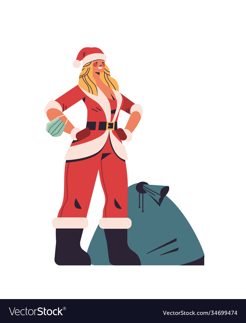 Woman in santa claus costume standing near sack