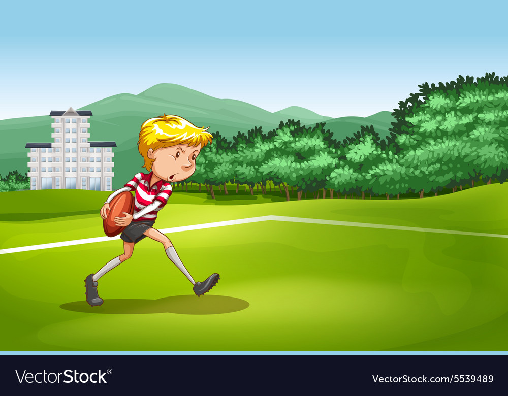 Boy playing rugby in the field