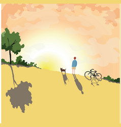 A Guy With Dog And Bike Watching The Sunset