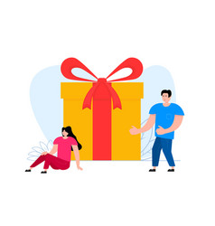 A Man And Woman Are Standing Near Gift Box