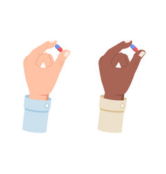 White And Black Hand Holding A Medical Pill