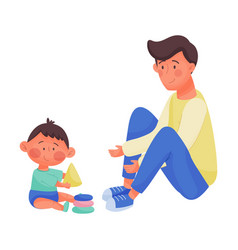 Young Dad And His Baby Playing With Toy Blocks