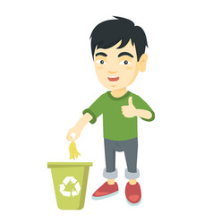 Little Boy Throwing Banana Peel In Recycling Bin