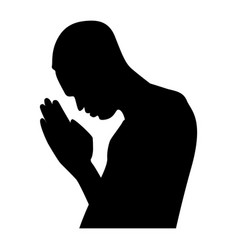 A Silhouette Of Man Praying