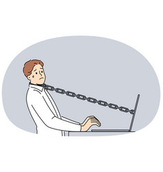 Stressed Male Employee Tied With Chain To Computer