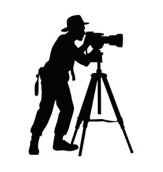 Silhouette Of One Person With Camera In Tripod