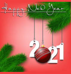 Cricket Ball And 2021 On A Christmas Tree Branch