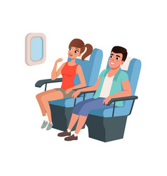 Young Tourist Couple Sitting In Airplane Seats