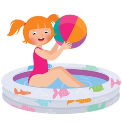 Little girl splashing in the summer inflatable poo