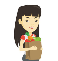 Happy Woman Holding Grocery Shopping Bag