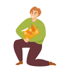 Caucasian Male Kneels Holding Grocery Paper Bag