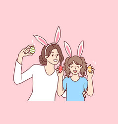 Easter Eggs In Hands Of Happy Mother And Daughter