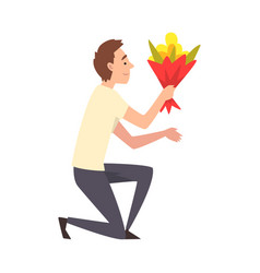 Young Man Kneeling Down With Bouquet Flowers