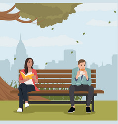 Woman Reading A Book Sitting On Bench In Park