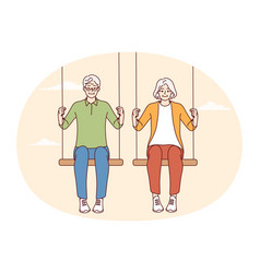 Energetic Old Couple Sit On Swings