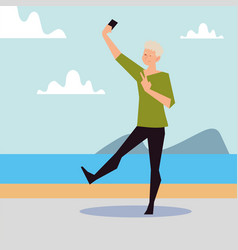 Blonde Man Taking Selfie On Seashore