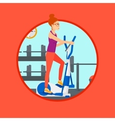 Woman Exercising On Elliptical Trainer